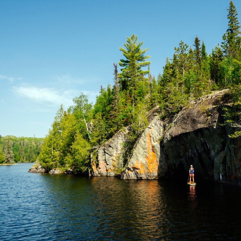 paddleboards on large river