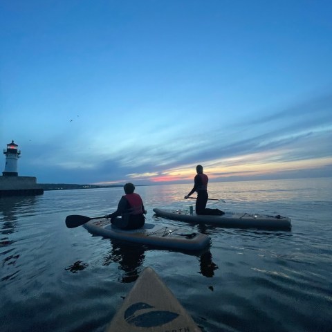a group of people on a boat in the water
