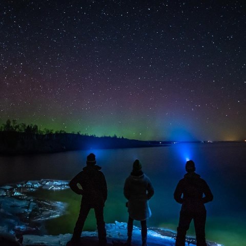 a group of people in a dark sky