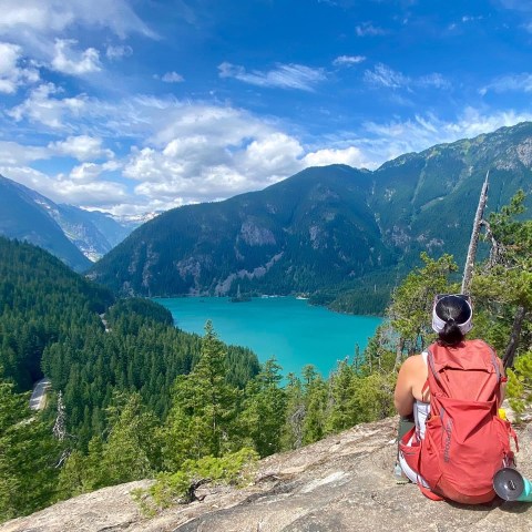 a body of water with a mountain in the background