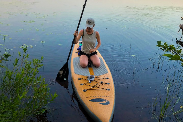 paddleboarder sitting on a Paddle North board