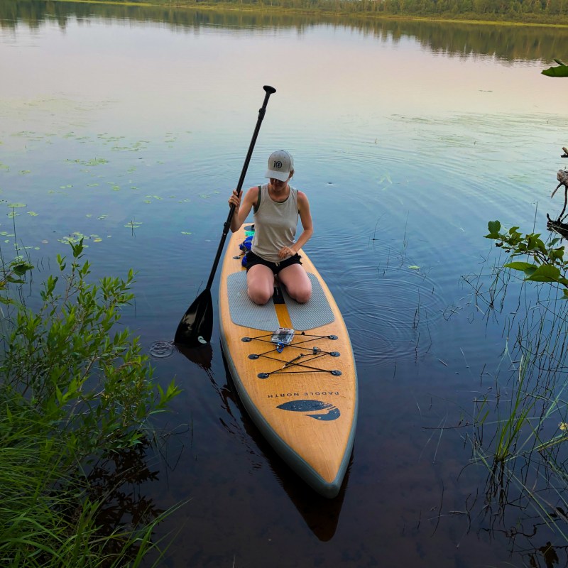 paddleboarder sitting on a Paddle North board