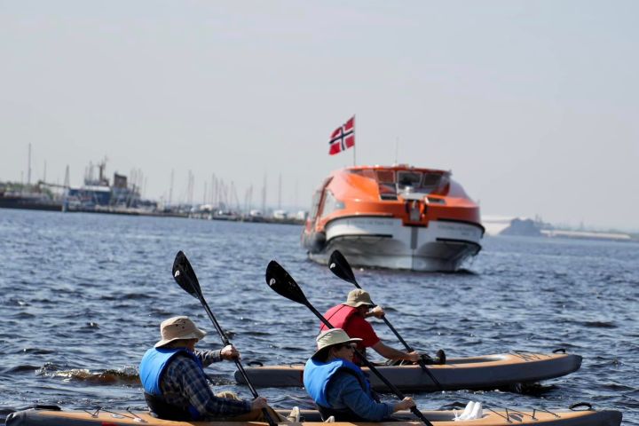 A group of people kayaking in Lake Superior
