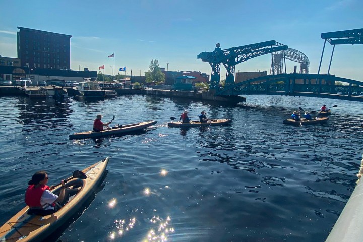 Group of kayakers heading out on a tour in Canal Park
